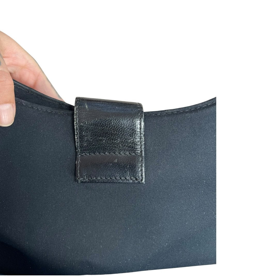 FENDI Nylon Canvas Baguette (though the shape is more of a hobo/shoulder bag, the buckle is iconic Fendi, often associated with Baguette styles) Shoulder Bag Black Silver Hardware Fe387