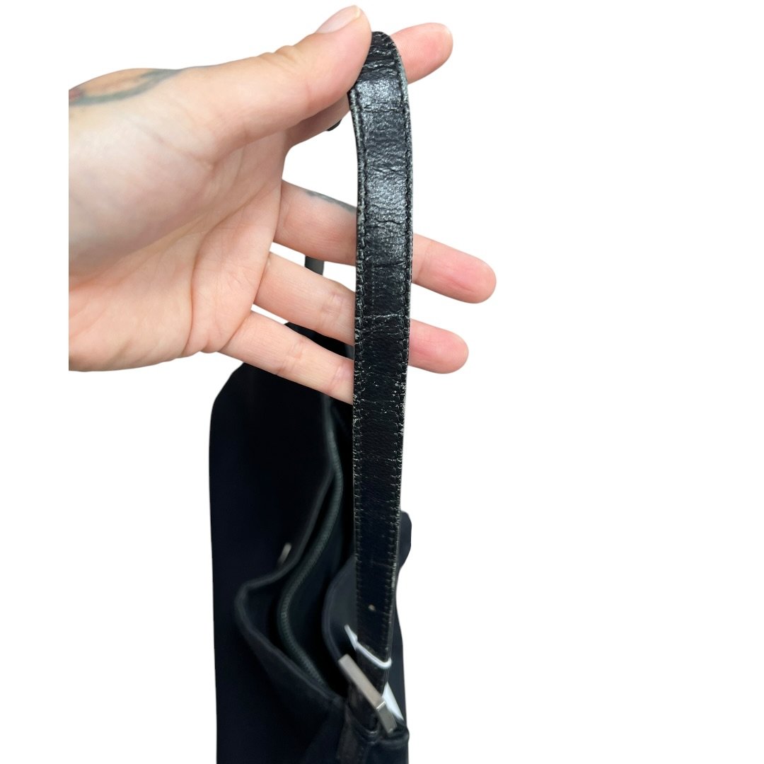 FENDI Nylon Canvas Baguette (though the shape is more of a hobo/shoulder bag, the buckle is iconic Fendi, often associated with Baguette styles) Shoulder Bag Black Silver Hardware Fe387